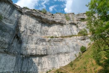 View of the curved cliff at Malham Cove in the Yorkshire Dales National Park