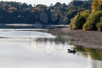 ARDINGLY, SUSSEX/UK - NOVEMBER 2 : Man fishing at the reservoir in Ardingly Sussex on November 2, 2018. Two unidentified people
