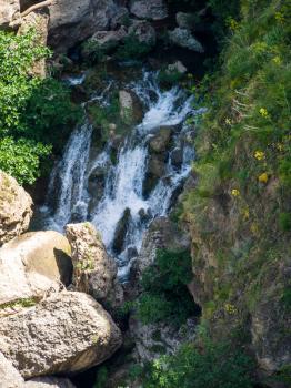 Waterfall below the New Bridge at Ronda Spain