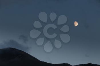 Moon rising over the Cairngorm mountains