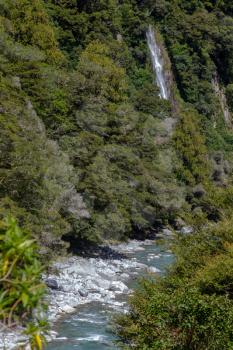 Rocky terrain and a waterfall at Thunder Creek in New Zealand