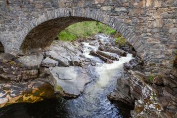 Old stone bridge spanning the River Tay in Scotland