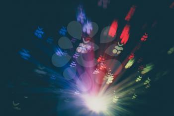 Bright colorful bokeh lights effect, abstract defocused background.