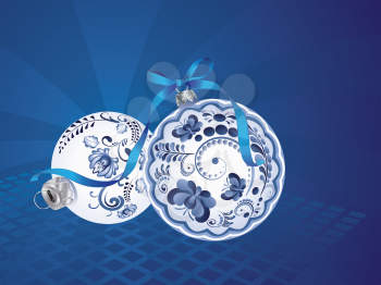 Festive christmas ball decorated with blue floral ornaments.