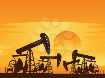Sunset background and working oil pump silhouette.
