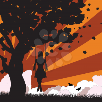 Silhouette of a girl on swing under the tree on sunset background.