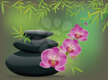 Black zen stones in a pile with orchid flowers.