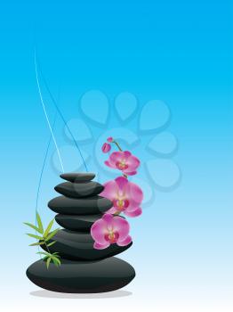 Black zen stones in a pile with orchid flowers.