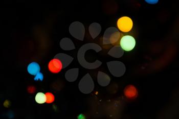Defocused Christmas tree lights, colorful bokeh background.