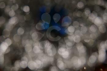 Abstract circular bokeh of grey blue colors background.
