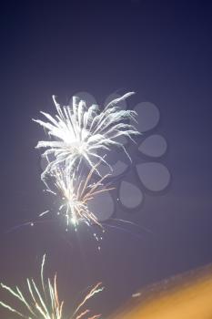 Photo of colorful fireworks against evening sky background. 