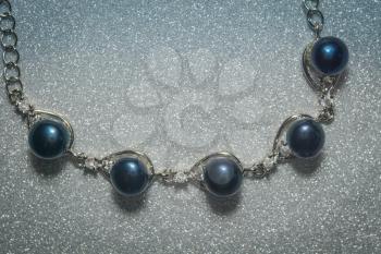 Decorative bracelet made of black fresh water pearls.