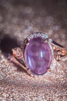 Fashion rose gold ring made of natural purple amethyst gemstone.