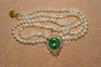 Natural white freshwater pearl necklace close up background.
