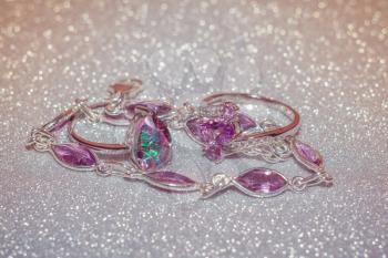 Fashion silver ring decorated with natural amethyst gemstone filtered.