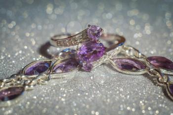 Fashion silver ring decorated with natural amethyst gemstone.