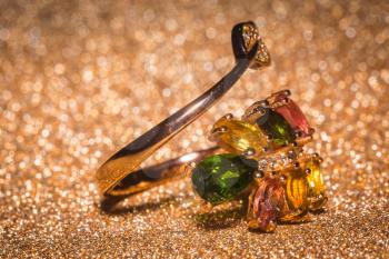 Fashion gold ring with colorful tourmaline stones.