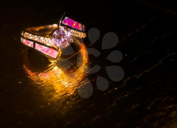 Fashion rose gold ring with pink zircon and synthetic opal stone.