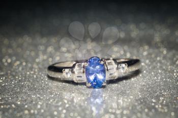 Fashion silver ring decorated with natural tanzanite stone.