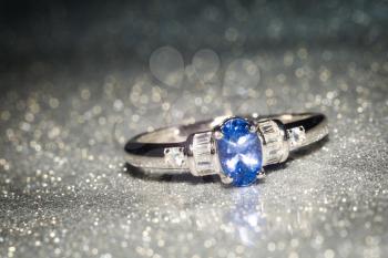 Fashion silver ring decorated with natural tanzanite stone.