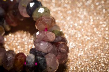 Boho beaded bracelet made of colorful spinel stone beads macro.
