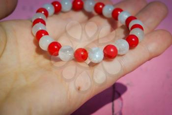 Boho bracelet made of white moonstone and red coral round beads.