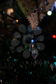 Holiday lights and christmas tree decorations background.