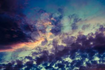 Summer sunset sky with clouds of red color, filtered background.