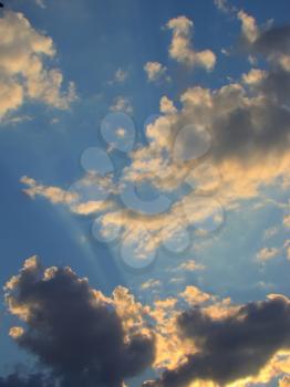 Photo of summer sky with clouds at sunset time.