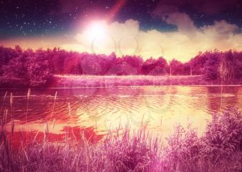 Fantasy sunset on the river, peaceful rural landscape. Photo manipulation