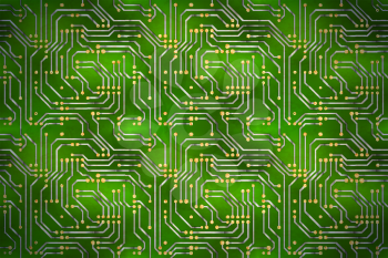 Complicated computer microchip with golden contacts on green motherboard, horizontal background