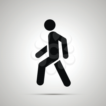 Walking man simple black icon with shadow