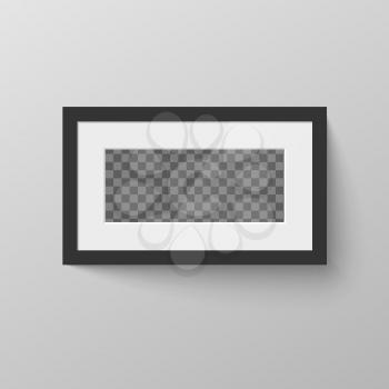 Horizontal black blank picture frame with transparent place for photo on gray wall
