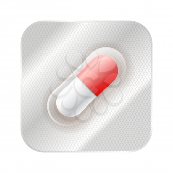 Red and white medicine capsule, pill in blister isolated on white