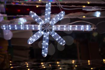 Christmas and party lights in the shape of a snowflake