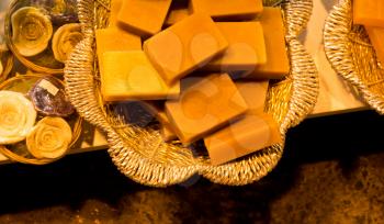 Collection of bars of fragrant hand made organic soap in a basket