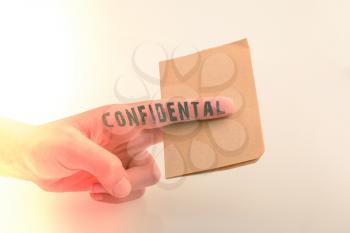 Brown paper  text confidental on a white background