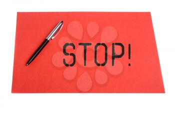 Stop word and pen and plain color paper on  isolated background