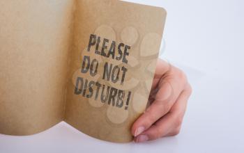 Please do not disturb label on paper on white background
