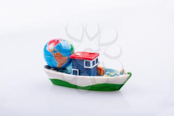 Little model globe on a boat in view