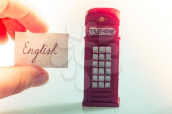 Notepaper with English wording near the British telephone booth