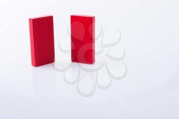 Red color domino blocks placed on a white background