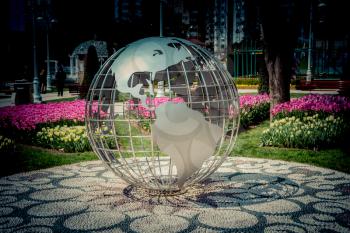 Little model globe made of metal in the  garden