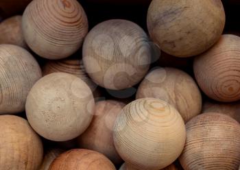 Plenty of  wooden balls of light brown color
