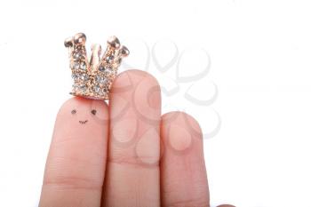 Finger with dots like a face and a crown on the top