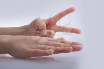 Hands showing the symbols rock paper scissors