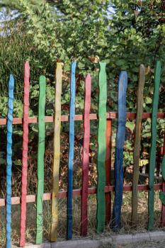 Close up of a part of decorative colorful wooden fence