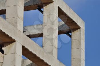 Modern building facade with columns. Abstract architectural structure.