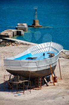 Fishing boat being repaired at a shipyard in the harbor of Zakynthos, Greece.
