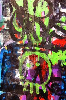 A wall covered with graffiti street art. Youth culture abstract background.